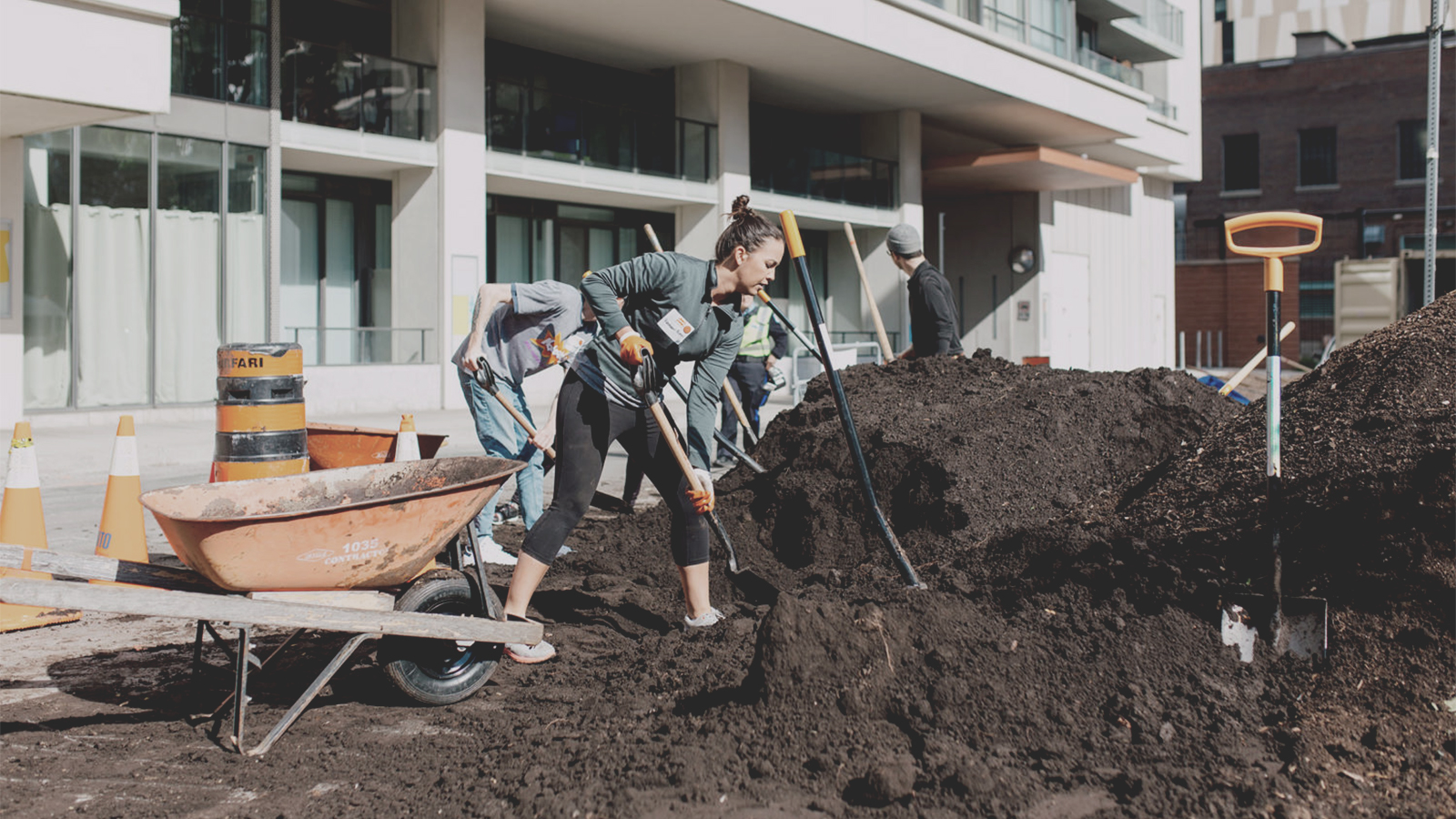 woman and team shoveling