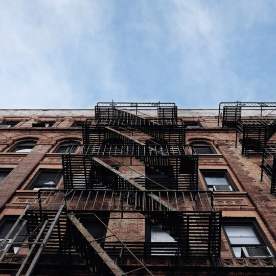 Outside facade of an apartment brick building