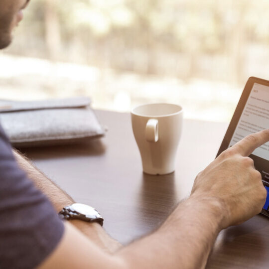 man pointing on a tablet screen