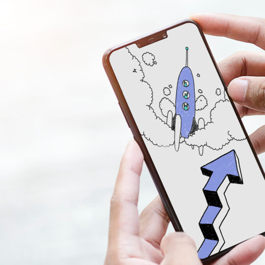 Mobile phone showing a rocket and an arrow representing programmatic ad trends