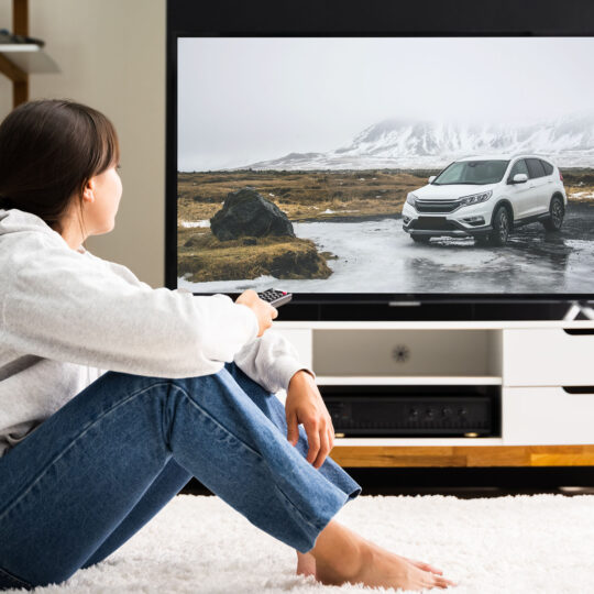 woman watching CTV advertising