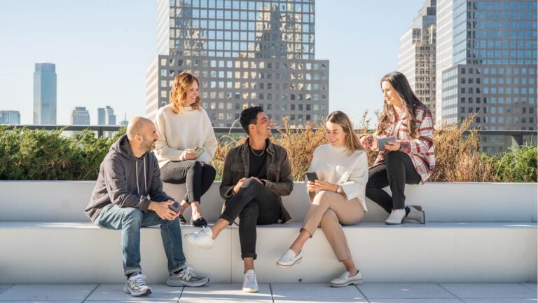 Index Exchange employees outside on bench for Sustainability