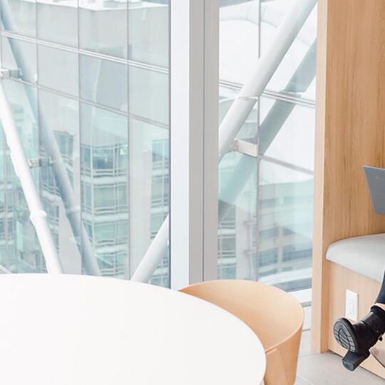 Two women meeting in high rise office