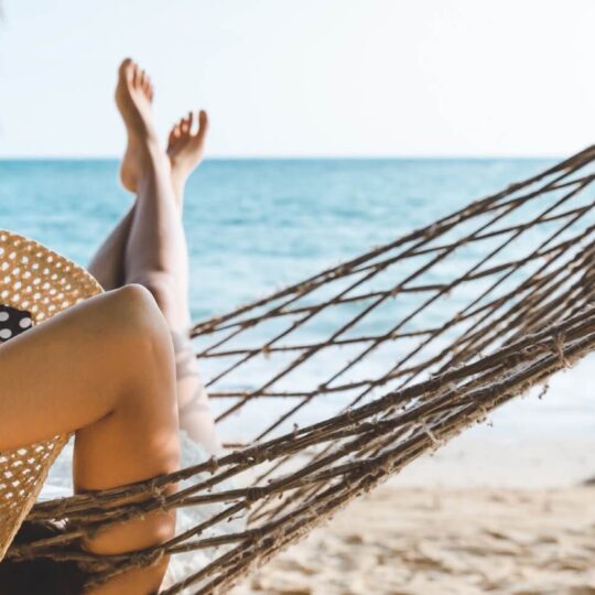 Relaxing in hammock at beach