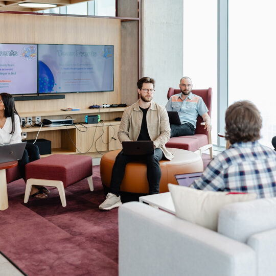 people in an office showing engineering at index