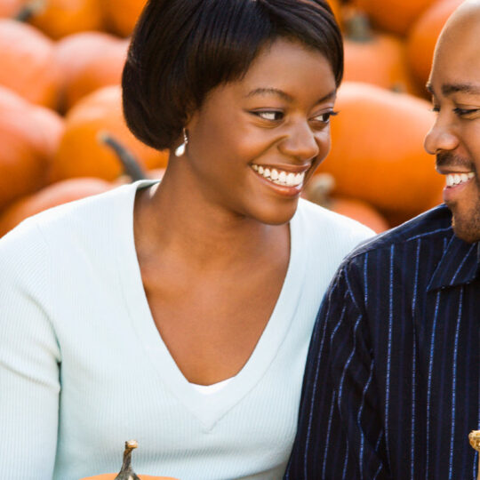 couple with pumpkins