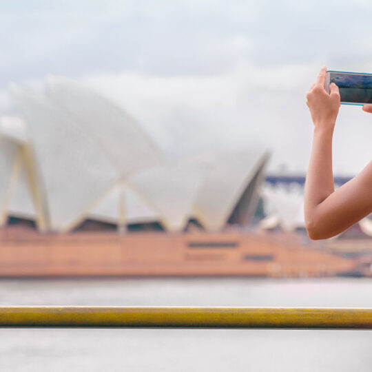 woman traveling and taking a photo