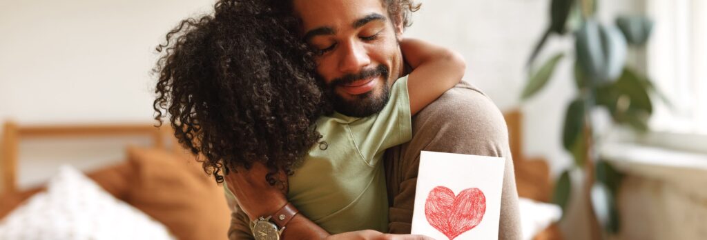 A father hugging their child