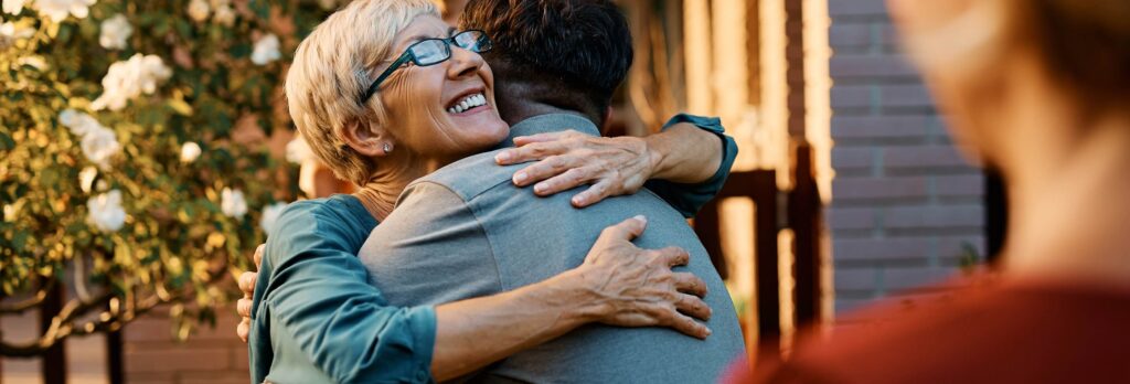 A mother embracing her son