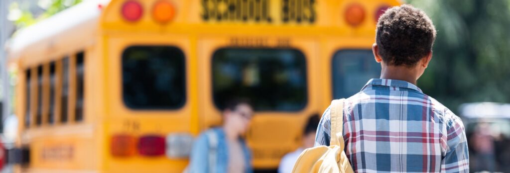 kids next to a school bus
