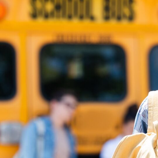 kids next to a school bus