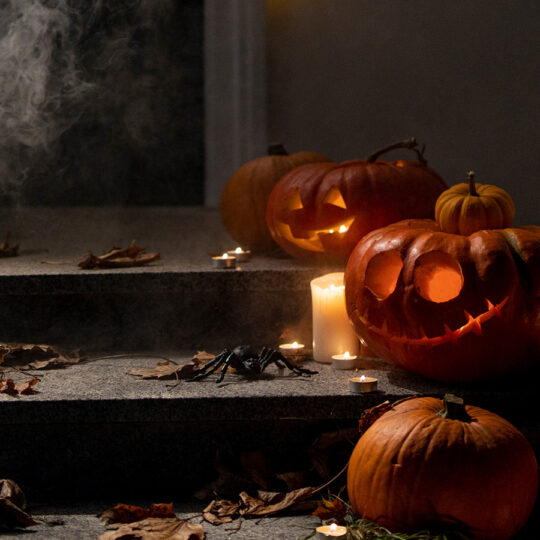 Jack-o-lanterns on a front stoop