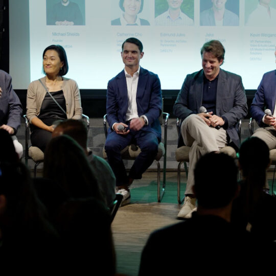 A panel of people speaking at Ad Breakfast