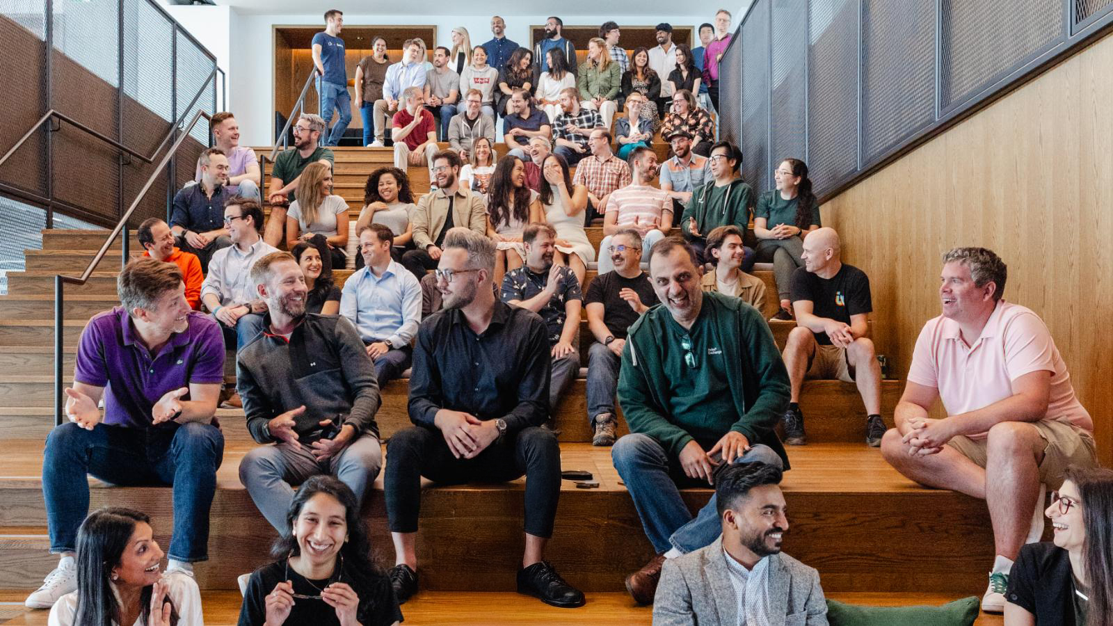 Employees sitting on steps
