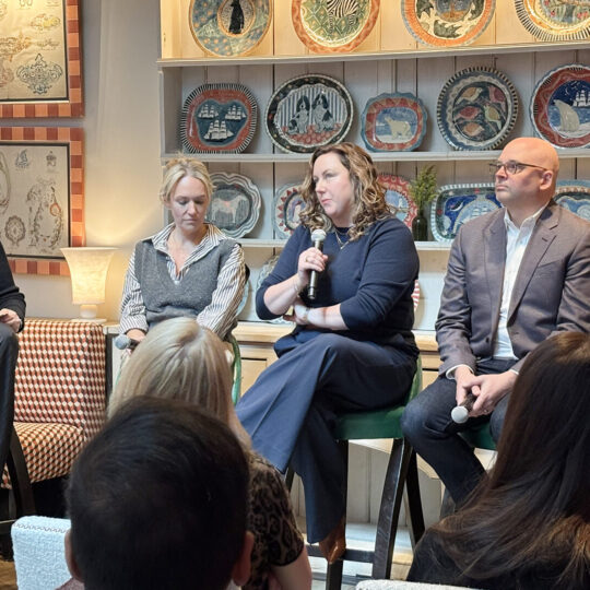 Panel of speakers talking at an event
