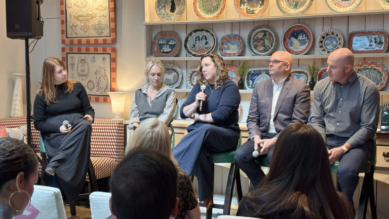 Panel of speakers talking at an event