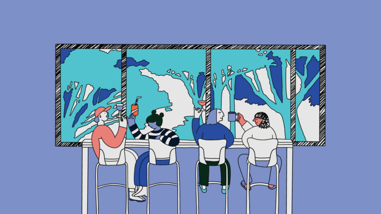 People sitting in front of a window with drinks.