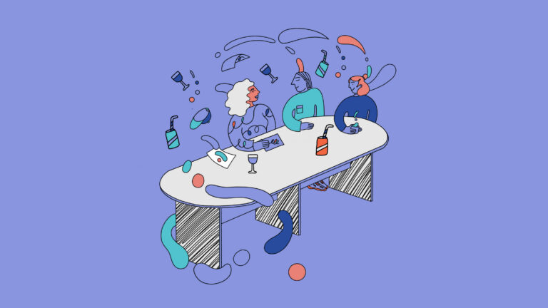 Three people sitting at a table.